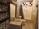 A very small bathroom features a single sink and shower-tub combo at 223 S Main St, Wendell, NC 27591