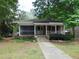 Classic brick home with a screened-in porch and a traditional design at 223 S Main St, Wendell, NC 27591