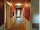 Hallway with multiple doorways and paneled walls at 223 S Main St, Wendell, NC 27591