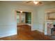 Vintage-style living room featuring hardwood floors and a decorative fireplace with mantel at 223 S Main St, Wendell, NC 27591