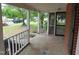Inviting porch view highlighting the neighborhood and a peek at the screened porch at 223 S Main St, Wendell, NC 27591