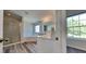 Bathroom featuring a soaking tub, shower, dual sink granite vanity top, and neutral color palette at 2428 Diquedo Dr, Raleigh, NC 27604