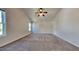 A spacious bedroom with neutral carpet and plenty of natural light at 2428 Diquedo Dr, Raleigh, NC 27604