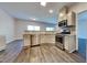 Well-equipped kitchen with stainless appliances, granite counters, and open layout to the living area at 2428 Diquedo Dr, Raleigh, NC 27604