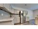 Updated kitchen with stainless steel refrigerator, granite countertops and stylish backsplash at 2428 Diquedo Dr, Raleigh, NC 27604
