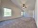 Bright main bedroom with vaulted ceilings, ceiling fan, and large windows with lots of light at 2428 Diquedo Dr, Raleigh, NC 27604