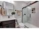 Beautiful bathroom features a modern shower with glass doors, vanity, and tile floors at 2437 Terri Creek Dr, Fuquay Varina, NC 27526