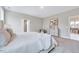 Serene bedroom with soft carpet, accent chair, and neutral decor, creating a relaxing atmosphere at 2437 Terri Creek Dr, Fuquay Varina, NC 27526