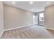 Large bedroom with new carpet, neutral paint, and lots of natural light from two windows at 2437 Terri Creek Dr, Fuquay Varina, NC 27526