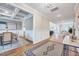 Open-concept view of the dining room featuring a coffered ceiling and direct access to the kitchen and living area at 2437 Terri Creek Dr, Fuquay Varina, NC 27526