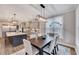 Dining area with views, features a modern light fixture, light walls and a table with seating for six at 2437 Terri Creek Dr, Fuquay Varina, NC 27526