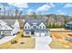 Beautiful two-story home with a three-car garage and a well-manicured lawn at 2437 Terri Creek Dr, Fuquay Varina, NC 27526