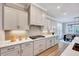 Modern kitchen featuring sleek countertops, stainless steel appliances, and light gray cabinetry at 2437 Terri Creek Dr, Fuquay Varina, NC 27526