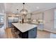 Spacious kitchen with a large island, stainless steel appliances, and sleek countertops at 2437 Terri Creek Dr, Fuquay Varina, NC 27526