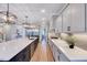 Modern kitchen featuring a large island, sleek countertops, and stainless steel appliances at 2437 Terri Creek Dr, Fuquay Varina, NC 27526