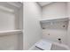 Spacious walk-in closet featuring white shelves, rod, and tile flooring at 2437 Terri Creek Dr, Fuquay Varina, NC 27526