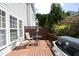 Cozy back deck space, including patio furniture and a grill for entertaining guests outdoors at 2507 Princewood St, Raleigh, NC 27612