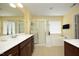 Bright bathroom features dual sinks, soaking tub and shower at 2507 Princewood St, Raleigh, NC 27612