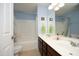 Bright, updated bathroom features dual sinks, tub, and shower combo at 2507 Princewood St, Raleigh, NC 27612