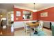 Charming dining area with hardwood floors, access to kitchen and view into a second living room at 2507 Princewood St, Raleigh, NC 27612