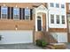 Front exterior of a brick townhome featuring an attached garage and an inviting front entrance at 2507 Princewood St, Raleigh, NC 27612