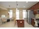 Kitchen featuring stainless steel appliances, granite countertops, and a view of the living area at 2507 Princewood St, Raleigh, NC 27612