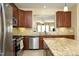 Kitchen featuring stainless steel appliances, granite counters, and tile backsplash at 2507 Princewood St, Raleigh, NC 27612