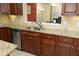 Kitchen featuring stainless steel appliances, granite counters, and tile backsplash at 2507 Princewood St, Raleigh, NC 27612