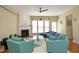 Living room features a fireplace, large windows, and hardwood floors at 2507 Princewood St, Raleigh, NC 27612