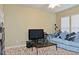 Spacious living room has a large window and comfortable seating at 2507 Princewood St, Raleigh, NC 27612