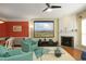 Bright living room with fireplace, mounted projection screen and hardwood floors at 2507 Princewood St, Raleigh, NC 27612
