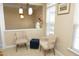 Bright living area with large windows, neutral walls, and charming furnishings at 2507 Princewood St, Raleigh, NC 27612