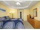 Bright main bedroom with a fan, carpet and multiple windows providing ample natural light at 2507 Princewood St, Raleigh, NC 27612