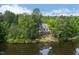 Beautiful lakefront property surrounded by dense forest offering serene privacy and natural beauty at 25303 Ludwell, Chapel Hill, NC 27517