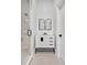 Modern bathroom features a glass shower, white vanity with black hardware, and sleek design at 25303 Ludwell, Chapel Hill, NC 27517