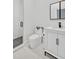 Stylish bathroom boasts a modern toilet, glass shower, and a white vanity with marble countertop at 25303 Ludwell, Chapel Hill, NC 27517