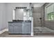 Stylish bathroom with a modern vanity, a large frameless glass shower, and contemporary fixtures at 25303 Ludwell, Chapel Hill, NC 27517