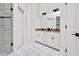 Spacious bathroom features dual sinks, white cabinets, granite countertops, and tiled floor and shower at 25303 Ludwell, Chapel Hill, NC 27517