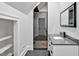 Modern bathroom with glass shower, gray tile, sleek vanity, and a clean, contemporary design at 25303 Ludwell, Chapel Hill, NC 27517