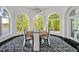 Dining area features a round table with lake views at 25303 Ludwell, Chapel Hill, NC 27517