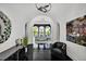 Elegant foyer featuring black floors, arched doorways, and a glimpse into the bright living room at 25303 Ludwell, Chapel Hill, NC 27517