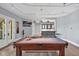 Inviting game room featuring a pool table, bar area with seating, and stylish decor for entertainment at 25303 Ludwell, Chapel Hill, NC 27517