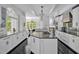 Spacious kitchen with a large island, granite counters, stainless appliances, and an open floor plan at 25303 Ludwell, Chapel Hill, NC 27517
