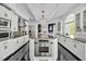 Bright kitchen with granite island, stainless steel appliances, and custom cabinetry, perfect for entertaining at 25303 Ludwell, Chapel Hill, NC 27517
