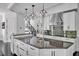 Gourmet kitchen with granite countertops, stainless steel appliances, and designer lighting fixtures at 25303 Ludwell, Chapel Hill, NC 27517