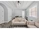 Spacious living room with ample seating, designer lighting, and neutral decor at 25303 Ludwell, Chapel Hill, NC 27517