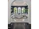 A view of the luxurious living room through an archway, showcasing waterfront access and modern decor at 25303 Ludwell, Chapel Hill, NC 27517