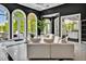Bright open-concept living room features lake views through arched windows and access to gourmet kitchen at 25303 Ludwell, Chapel Hill, NC 27517