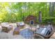 Outdoor patio featuring cozy wicker furniture, stylish patterned rug, and a relaxing outdoor living space at 25303 Ludwell, Chapel Hill, NC 27517