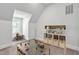 Fun playroom with toys, table, and cubbies with light from windows, perfect for to play at 25303 Ludwell, Chapel Hill, NC 27517